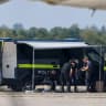 Police officers work in the vicinity of an Antonov cargo plane, near which a drone was found, at Leipzig/Halle Airport in Schkeuditz, Germany, August 5, 2026.