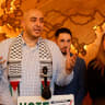 Abbas Alawieh, Dearborn Mayor Abdullah Hammoud and Layla Elabed, campaign manager for Listen to Michigan, speak to the press one day after the Michigan presidential primary, at Haraz Coffee House in Dearborn, Michigan, on February 28, 2024.