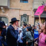 Ultra-Orthodox protesters demonstrate against a cafe operating on Shabbat and clash with Israeli police, while secular protesters hold a counter-demonstration in support of the cafe in central Jerusalem, August 8, 2026. 
