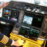 A pilote on the flight deck in the Airbus A350X WB passenger plane as he stands on the tarmac at Munich Airport during a presentation of the new plane by Airbus officials on February 27, 2015; illustrative.