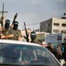 Hamas terrorists celebrating during a rally in the northern Gaza Strip.
