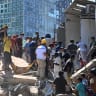 People look for survivors amid the rubble of a collapsed building after an earthquake in Cali, Colombia on August 10, 2026.