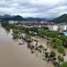 A drone view shows a flooded village following heavy rainfall brought by Typhoon Dolphin, in Dajing town, Yueqing, Zhejiang province, China, August 10, 2026.