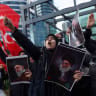 Demonstrators holding posters of Iran's slain supreme leader Ayatollah Ali Khamenei during a protest against Israel and the US strikes on Iran, in Istanbul, Turkey, March 1, 2026
