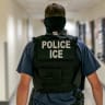  A federal immigration officer patrols the hallway at US immigration court in Manhattan, in New York City, US, June 26, 2025