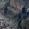 Footage showing extremist settlers throwing rocks in the West Bank village of Kusra, August 12, 2026.