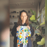 MIRIAM AGRANAT with a collectible Tiftaf onesie.