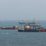 FROM THE viewpoint of the Iranian people’s economic future, Iran’s closure of the Strait of Hormuz is a shot in the foot, the writer argues. Here, ships are anchored in the strait off the port of Bandar Abbas, Iran, this week. 