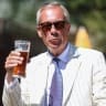 Britain's Reform UK party leader Nigel Farage visits The Ship, on the day of voting in the Clacton by-election, triggered by his own resignation, in Kirby Le Soken, Essex, Britain, August 13, 2026. 