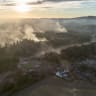 An aerial view shows burnt houses as the wildfire continues to spread to the golf course on August 14, 2026 in Stourbridge, England. During the UK's hottest day of the year, with temperatures soaring to 38.1°C, an extensive wildfire has spread to at least six homes on the edge of the golf course in 