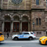 New York Police Department officers stand guard at Central Synagogue in New York, US, December 11, 2019. 