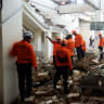 Rescuers inspect a heavily-damaged building at L. Say port following an earthquake in Maumere, Sikka, East Nusa Tenggara province, Indonesia, August 15, 2026.