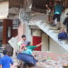 People evacuate from a building collapse at Jayakarta hotel following an earthquake of magnitude 7.7, in Labuan Bajo, East Nusa Tenggara, Indonesia, August 15, 2026.
