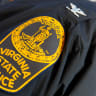 This December 13, 2012 photo shows the patch on the sleeve of a Virginia State Police officer during an event at the US Department of Transportation in Washington, DC. 