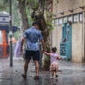 People walk in the rain in Jerusalem, August 15, 2026.