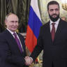 Russian President Vladimir Putin and Syria's President Ahmed al-Sharaa shake hands during a meeting at the Kremlin in Moscow on January 28, 2026. 