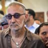 Israeli singer Shimon Buskila attends the funeral of Israeli singer Yishai Levi at the cemetery in Rosh HaAyin, central Israel, June 7, 2026.