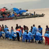Passengers who disembarked from a boat intercepted by health authorities wait to be tested following the death of a passenger suspected of having Ebola, in Kinshasa, Democratic Republic of the Congo, August 6, 2026.
