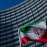 The flag of Iran is seen outside the International Atomic Energy Agency (IAEA) headquarters during a meeting of the IAEA Board of Governors on March 02, 2026 in Vienna, Austria;illustrative