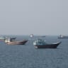 Vessels near the Strait of Hormuz, as seen from Musandam, Oman, August 17, 2026.