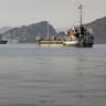 Cargo vessels remain anchored off Port Sultan Qaboos on June 20, 2026, in Muscat, Oman; illustrative