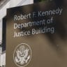 A sign is displayed at the Robert F. Kennedy Department of Justice Building, headquarters of the U.S. Department of Justice on August 8, 2026 in Washington, DC; illustrative