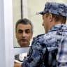 A bailiff puts handcuffs on Russian opposition politician Lev Shlosberg, sentenced to 11 years in prison over his criticism of Moscow's offensive in Ukraine at a city court in Pskov, northwestern Russia on August 17, 2026. 
