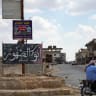 A man rides a motorbike in the town of Abu al-Duhur, Syria, August 18, 2026