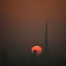 The sun sets over the Dubai skyline featuring the Burj Khalifa, the world's tallest building, in Dubai on August 6, 2026. 