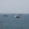 Vessels near the Strait of Hormuz, as seen from Musandam, Oman, August 17, 2026. 