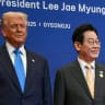 US President Donald Trump (L) and South Korea's President Lee Jae Myung take their position for a family photo with other leaders upon their arrival for a special dinner hosted in honour of US President Donald Trump and state leaders at the Hilton Gyeongju hotel in Gyeongju on October 29, 2025.