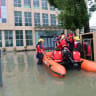 Firefighters evacuate workers from a flooded factory following heavy rains in Wenling city, Taizhou eastern China's Zhejiang province on August 12, 2026. (Illustrative)