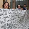 People hold a picture and a placard with names of young people, as parents of children and young adults whose deaths were allegedly related to social media use hold a press conference, as Meta faces a landmark trial in federal court on August 18, 2026 in Oakland, California, US.