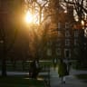 Students walk through campus at Harvard University on April 17, 2025 in Cambridge, Massachusetts; illustrative