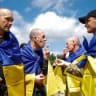 Ukrainian prisoners of war (POWs) smoke cigarettes after a swap, amid Russia's attack on Ukraine, at an undisclosed location in Ukraine August 19, 2026.