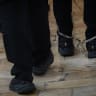 Illustration of arrested suspects on their way to hearing at a District Court.