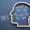 The word “yes” appears outside a head filled with the word “no.”