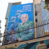 A billboard depicting Israel's Prime Minister Benjamin Netanyahu with text in Persian reading "Hitanyahu" and text in Hebrew reading "Germany's Nazi of today" at Palestine Square in central Tehran on August 11, 2025.
