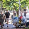Ongoing issue: a homeless man sits on Tel Aviv’s Rothschild Blvd., July 28; on the same city’s Ben-Gurion Blvd., 1970s. 