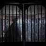 Taliban members are seen from a window as they inspect inside a prison cell at Pul-e-Charkhi prison, located on the outskirts of Kabul on October 17, 2021.