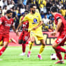 REIGNING CHAMPION Hapoel Beersheba (in red) and Maccabi Tel Aviv (in yellow) battle for possession as the two Israeli giants prepare for another season of Premier League competition, which begins this weekend.