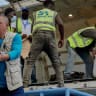 UNICEF staff and airport workers receive an aircraft carrying medical supplies as authorities and aid agencies intensified efforts to contain a new Ebola outbreak involving the Bundibugyo strain at the Bunia National Airport in Bunia, Ituri province, Democratic Republic of Congo, May 19, 2026.