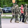 Armed police officers work outside Brinellskolan during a major emergency response, after several people were injured at a Swedish high school by a person armed with a sword, according to the officials of the Fagersta municipality, at Brinell School, in Fagersta, central Sweden, August 21, 2026.