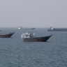 Vessels near the Strait of Hormuz, as seen from Musandam, Oman, August 17, 2026. 