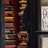 A New York Magazine cover reading 'Don't Panic' is displayed on the door of a magazine shop, March 15, 2020