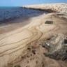 This photograph obtained from Iran's ISNA news agency on August 13, 2026 shows an oil slick along the southern coast of Qeshm Island, Iran, August 13, 2026. 