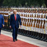 U.S. President Donald Trump reviews an honor guard with Chinese President Xi Jinping during a welcome ceremony at the Great Hall of the People on May 14, 2026 in Beijing, China. 