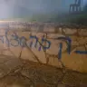 Graffiti reading "Revenge 30 for Benayahu" at the Palestinian village of Awarta near Nablus in the West Bank, August 23, 2026.