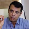 Palestinian senior Fatah official Mohammed Dahlan gestures during an interview at his office in Abu Dhabi on September 16, 2015.