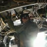 A US Navy aircrew member gives a thumbs-up inside an MV-22 Osprey aboard the aircraft carrier USS Theodore Roosevelt (CVN-71) while the ship is moored in Honolulu, Hawaii, during Exercise RIMPAC (Rim of the Pacific) 2026 on July 17, 2026. 